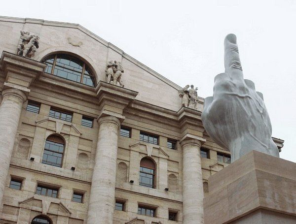 Middle finger in front of Stock Exchange bujilding in Milan