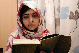 Malala reads a book in an undated photo released Nov. 9, 2012. (Queen Elizabeth Hospital)