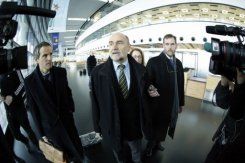 International Atomic Energy Agency chief inspector Herman Nackaerts (C) talks with journalists as he leaves for Iran on February 12, 2013 from Schwechat airport near Vienna, Austria