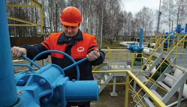   A worker turns a valve at the first pump station on Belarus territory of the Druzhba pipeline, near the village of Bobovichi, about 330 kilometres southeast of Minsk