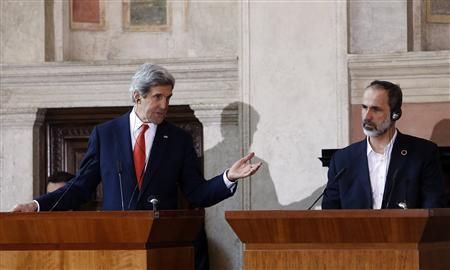 U.S. Secretary of State John Kerry (L) gestures next to Syrian National Coalition head Mouaz al-Khatib, Rome, February 28, 2013. Photo: Reuters