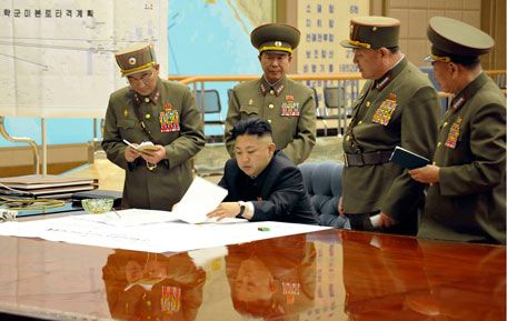 North Korean leader Kim Jong-un (C) presides over an urgent operation meeting on the Korean People's Army Strategic Rocket Force's performance of duty for firepower strike at the Supreme Command in Pyongyang. (REUTERS)