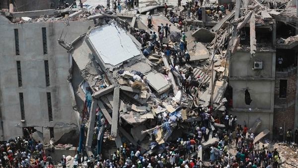 People rescue garment workers trapped under rubble at the Rana Plaza building after it collapsed, in Savar, 30 km (19 miles) outside Dhaka April 24, 2013. (Reuters)