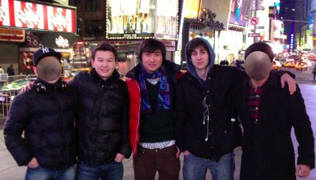 Boston Marathon bombing Dzhokhar Tsarnaev (second from right) stands with Azamat Tazhayakov (second from left) and Dias Kadyrbayev (center) in Times Square. Tsarnaev revealed intentions to bomb Times Square, and Tazhayakov and Kadyrbayev were both arrested for visa violations on Saturday.  