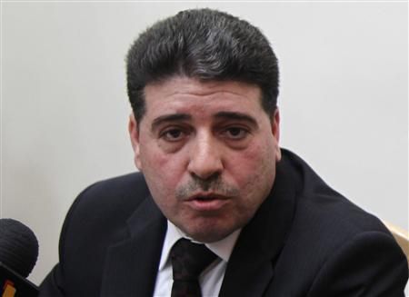 Syrian Prime Minister Wael al-Halki speaks to the media at his office in Damascus, April 3, 2012. Credit: Reuters