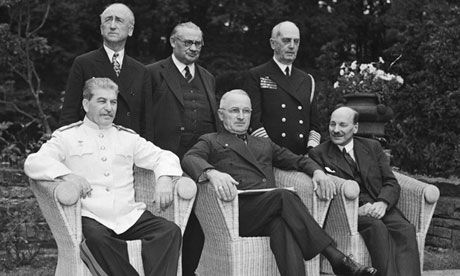   August 1945: British wartime prime minister Clement Attlee, seated right, with US president Harry Truman, and Stalin. Foreign secretary Ernest Bevin stands behind, centre. Photograph: Yevgeny Khaldei/Corbis