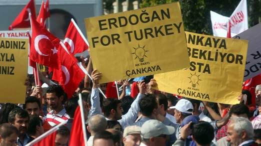 Supporters of Mr Erdogan wave placards @Sky News