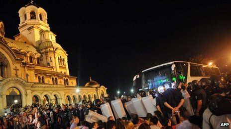 Demonstrators reportedly threw stones at a bus trying to leave the building