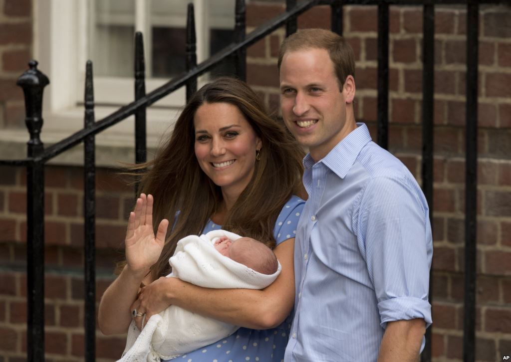 Prince William and Kate, Duchess of Cambridge, hold the Prince of Cambridge 