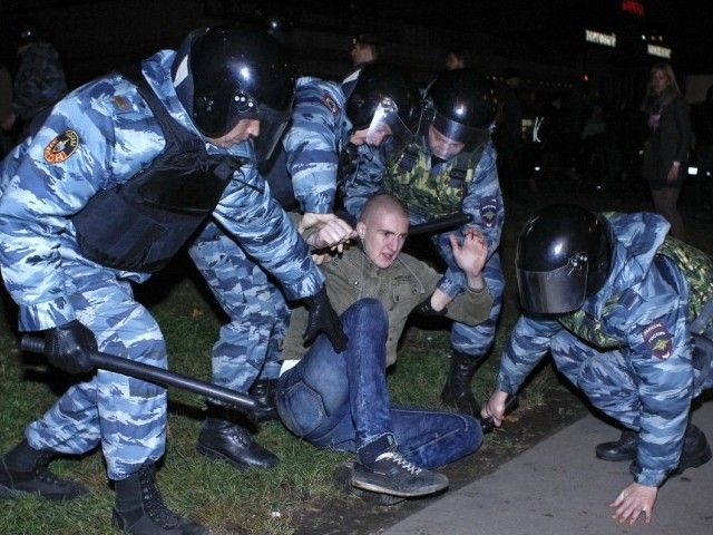 Russian police detain a man after a protest in the Biryulyovo district of Moscow October 13, 2013. PHOTO: REUTERS