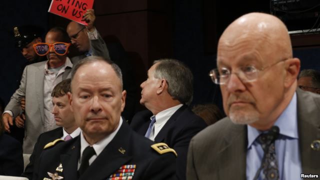 U.S. Director of National Intelligence James Clapper (right) and General Keith Alexander, director of the National Security Agency, testify at a House Intelligence Committee hearing on October 29.