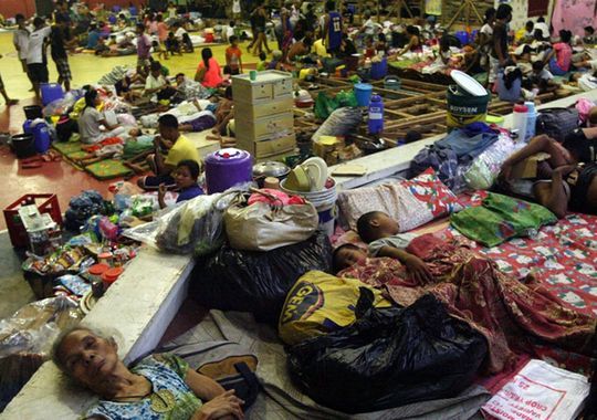 Filipino residents sleep on the floor at a gymnasium turned into an evacuation center in Sorsogon City, Bicol region, Philippines, on Nov. 7.(Photo: Kit Recebido, epa)