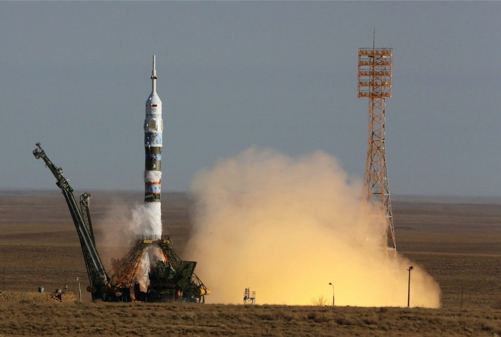 Soyuz rocket booster lifts of from Baikonur cosmodrome, carrying members of the next mission to the International Space Station in Kazakhstan on Nov. 7, 2013. (EPA Photo/Sergei Chirikov)