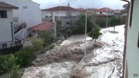 Flood water gushed down roads and into homes