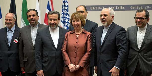 EU High Representative for Foreign Affairs and Security Policy Catherine Ashton, (C), poses next to Iranian Foreign Minister Mohammad Javad Zarif and the Iranian delegation after an agreement was reached on Iran's nuclear program at the United Nations in Geneva, Switzerland, Sunday, Nov. 24, 2013. (Photo: AP, Martial Trezzini)