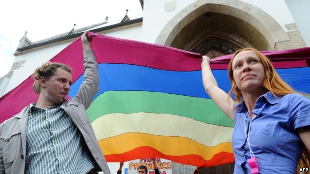 Gay rights activists display a rainbow flag in Zagreb in May, 2013.