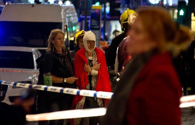 A woman stands bandaged and wearing a blanket given by emergency services following a roof collapse at the Apollo Theatre on London's Shaftesbury Ave. Thursday evening.  Read more: http://www.nydailynews.com/news/world/balcony-collapses-apollo-theatre-central-london-article-1.1553139#ixzz2nz834wOv