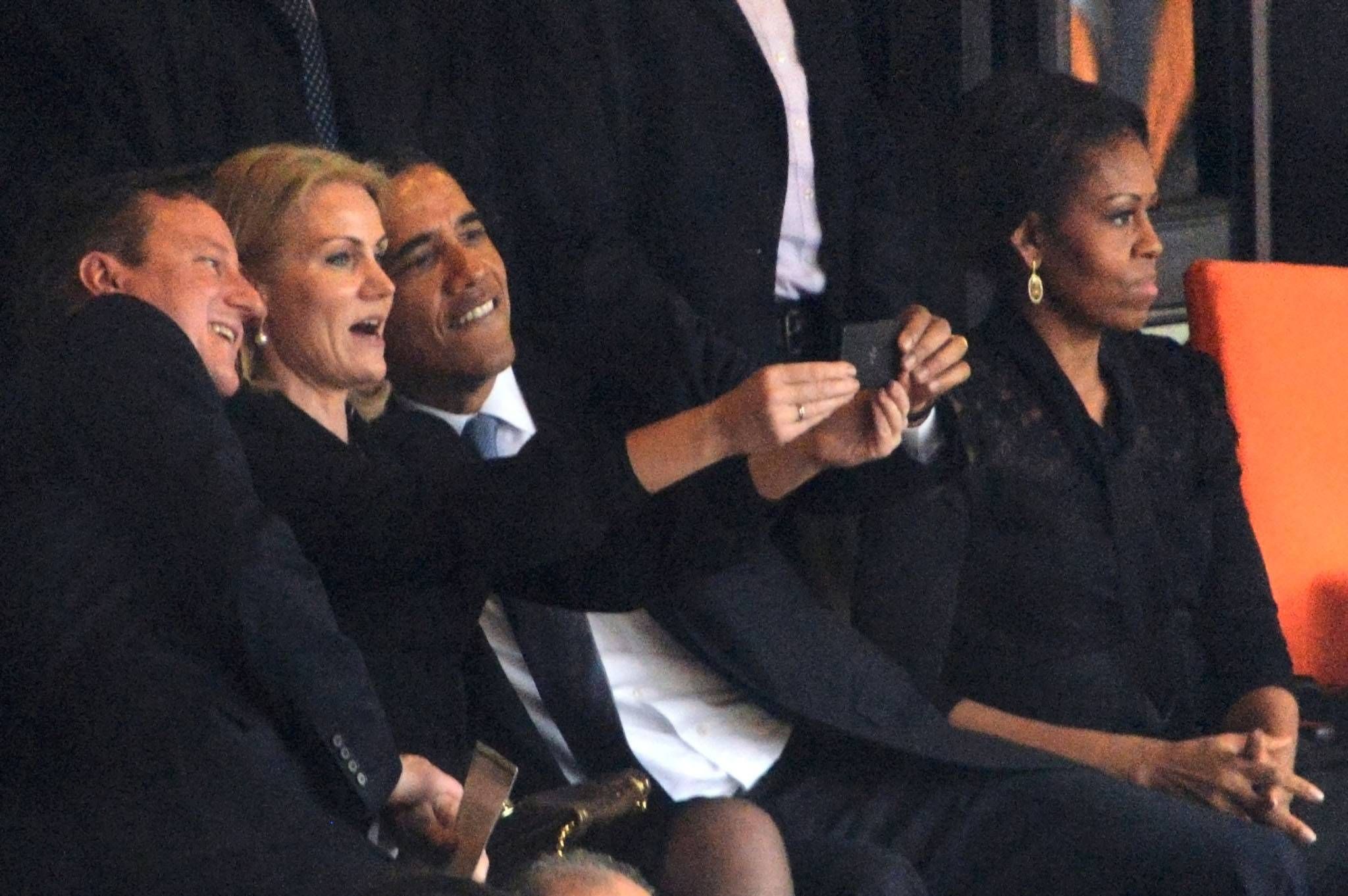 Obama and Cameron cosy up for ‘inappropriate’ selfie with Danish PM at Nelson Mandela’s memorial service