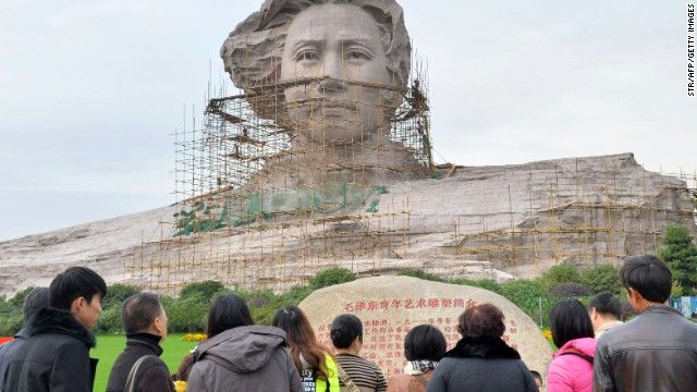 Tourists visit the statue of Mao Zedong ahead of his 120th birthday.