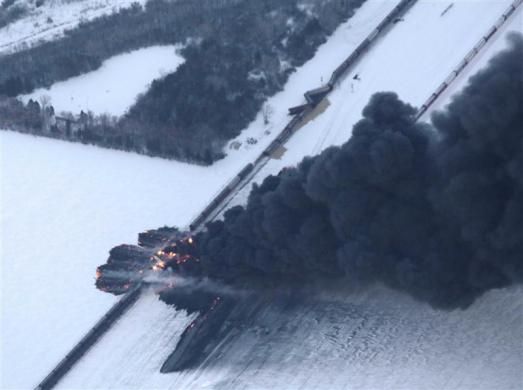 Smoke rises from scene of a derailed train near Casselton, North Dakota December 30, 2013. 