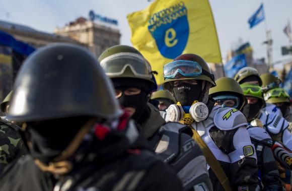 Members of various anti-government paramilitary groups gather at Independence Square during a show of force in Kiev, January 29, 2014.