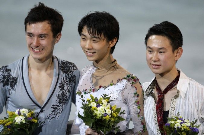 Denis Ten of Kazakhstan (R), Yuzuru Hanyu of Japan (C), Patrick Chan of Canada (L) on the podium during the flower ceremony for the men's free skate figure skating final during the 2014 Winter Olympics, Friday, Feb. 14, 2014, in Sochi (AP photo)