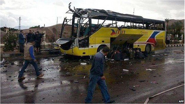 The wreckage of a tourist bus at the site of an explosion in the Egyptian town of Taba No group has said it carried out the attack