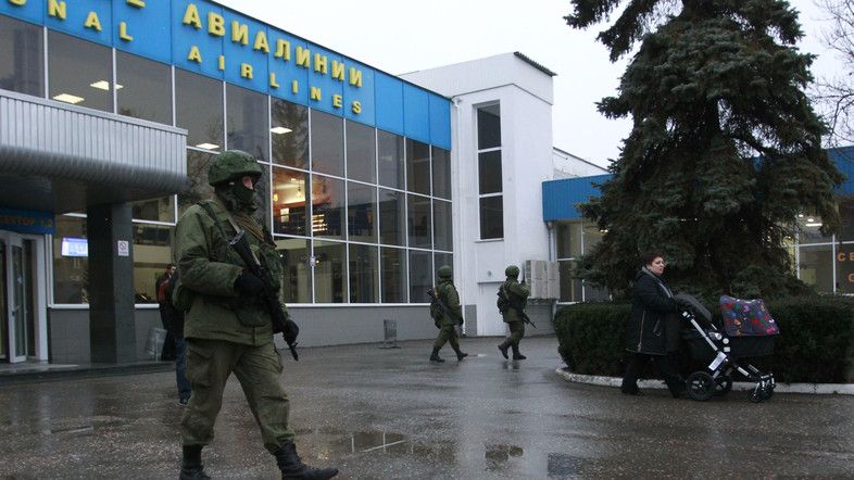 Armed men patrol at the airport in Simferopol, Crimea February 28, 2014. (Reuters)