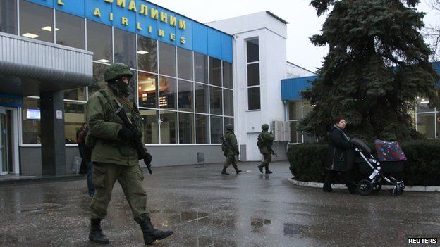 Armed men arrived at Simferopol airport in several trucks, and carrying Russian navy flags