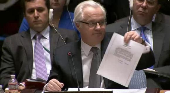 Vitaly Churkin, Russia's ambassador to the United Nations, shows a letter to the U.N. Security Council in New York purportedly from ousted Ukrainian leader Viktor Yanukovich to Vladimir Putin asking the Russian leader for military intervention in Ukraine in this still image from UNTV video March 3, 2014.