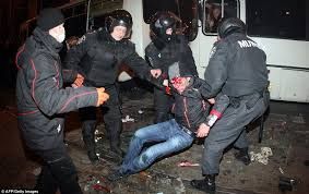 Policemen grab a man during clashes between pro-Russian and pro-Ukrainian activists during a rally in the eastern Ukrainian city of Donetsk  Read more: http://www.dailymail.co.uk/news/article-2580148/Russia-confirms-moved-thousands-troops-Ukrainian-borders-Putin-warned-sanctions-ugly-fast-John-Kerry.html#ixzz2vutpXsmj  Follow us: @MailOnline on Twitter | DailyMail on Facebook