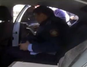Screenshot of video where the police officer was detained red-handed. The source:Financial police of Atyrau Oblast.