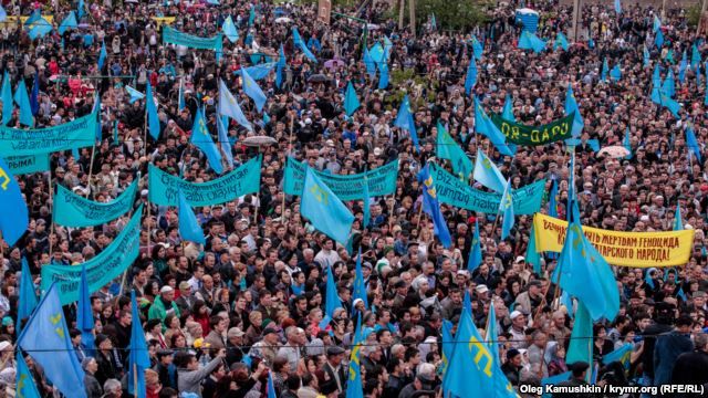 Crimean Tatars mourn those killed in the deportation at a rally on May 18 in Simferopol.