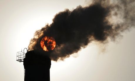 he sun is seen behind smoke billowing from a chimney of a heating plant in Taiyuan, Shanxi province (Photo:Reuters)