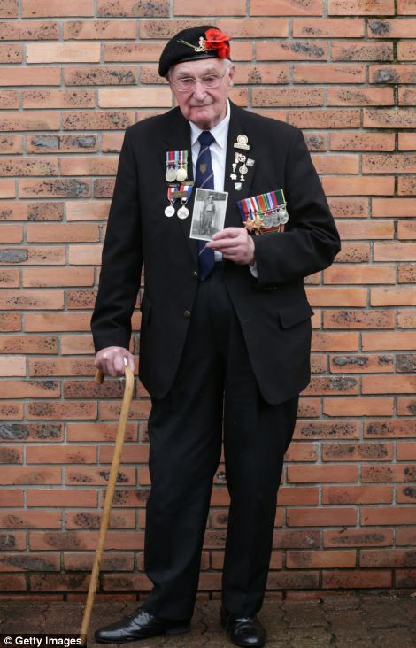 John Ainsworth, 93, who was in the Royal Artillery, brought a photograph of himself taken in 1940.