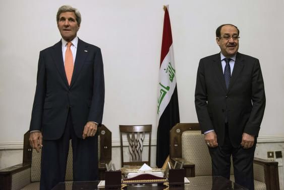 Iraqi Prime Minister Nuri al-Maliki (R) and U.S. Secretary of State John Kerry meet at the Prime Minister's Office in Baghdad June 23, 2014. 