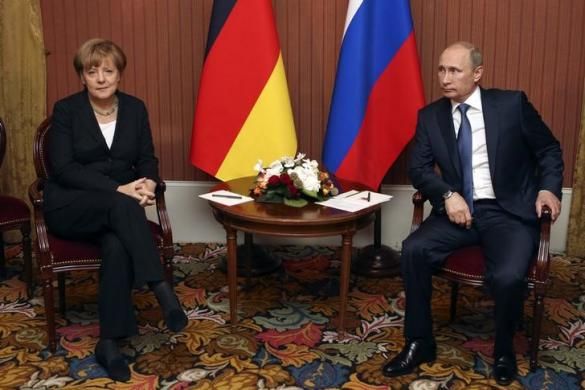 Russian President Vladimir Putin meets with German Chancellor Angela Merkel in Deauville, Northern France June 6, 2014. 