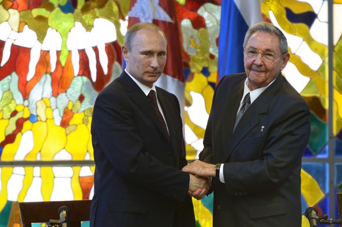 Russian President Vladimir Putin, left, and President of the Council of State and Ministers of the Republic of Cuba Raul Castro Ruz during a press statement at the Palace of the Revolution in Havana. (RIA Novosti)