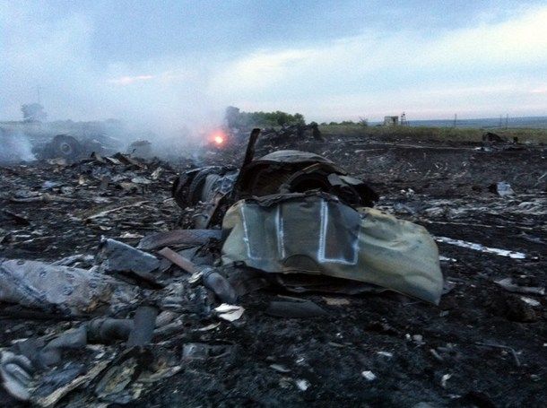 A picture taken on July 17, 2014 shows wreckages of the malaysian airliner carrying 295 people from Amsterdam to Kuala Lumpur after it crashed, near the town of Shaktarsk, in rebel-held east Ukraine. Pro-Russian rebels fighting central Kiev authorities claimed on Thursday that the Malaysian airline that crashed in Ukraine had been shot down by a Ukrainian jet. AFP photo.