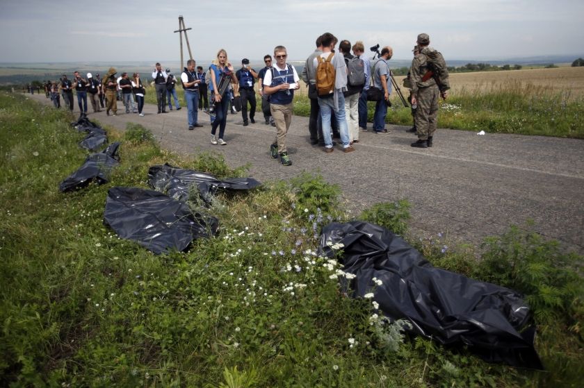 Organisation for Security and Cooperation in Europe (OSCE) monitors walk at the crash site of Malaysia Airlines Flight MH17, near the settlement of Grabovo in the Donetsk region July 20, 2014. ― Reuters pic - See more at: http://www.themalaymailonline.com/malaysia/article/observers-got-under-3-hours-at-mh17-crash-site-us-claims#sthash.KkRiQIo6.dpuf