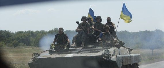 Ukrainian troops move near the village of Debaltseve, Donetsk region, eastern Ukraine, Thursday, July 31, 2014. (AP Photo)