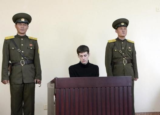 U.S. citizen Matthew Todd Miller sits in a witness box during his trial at the North Korean Supreme Court
