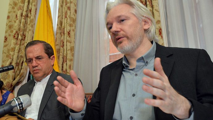 WikiLeaks founder Julian Assange (R) speaks as Ecuador's Foreign Affairs Minister Ricardo Patino listens, during a news conference at the Ecuadorian embassy in central London August 18, 2014. (Reuters