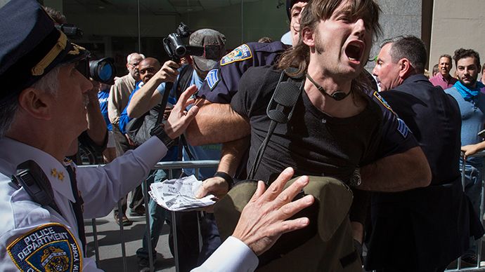 New York City police officers arrest a man taking part in the Flood Wall Street demonstration in Lower Manhattan, New York September 22, 2014. (Reuters / Adrees Latif)