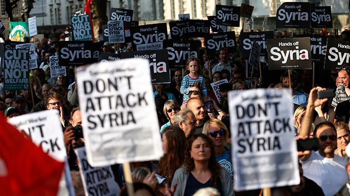 Protesters listen to speeches during a rally against the proposed attack on Syria in central London August 28, 2013 (Reuters)