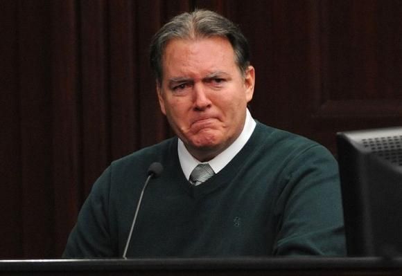 Defendant Michael Dunn reacts on the stand during testimony in his own defense during his murder trial in Duval County Courthouse in Jacksonville, Florida in this photo taken February 11, 2014.