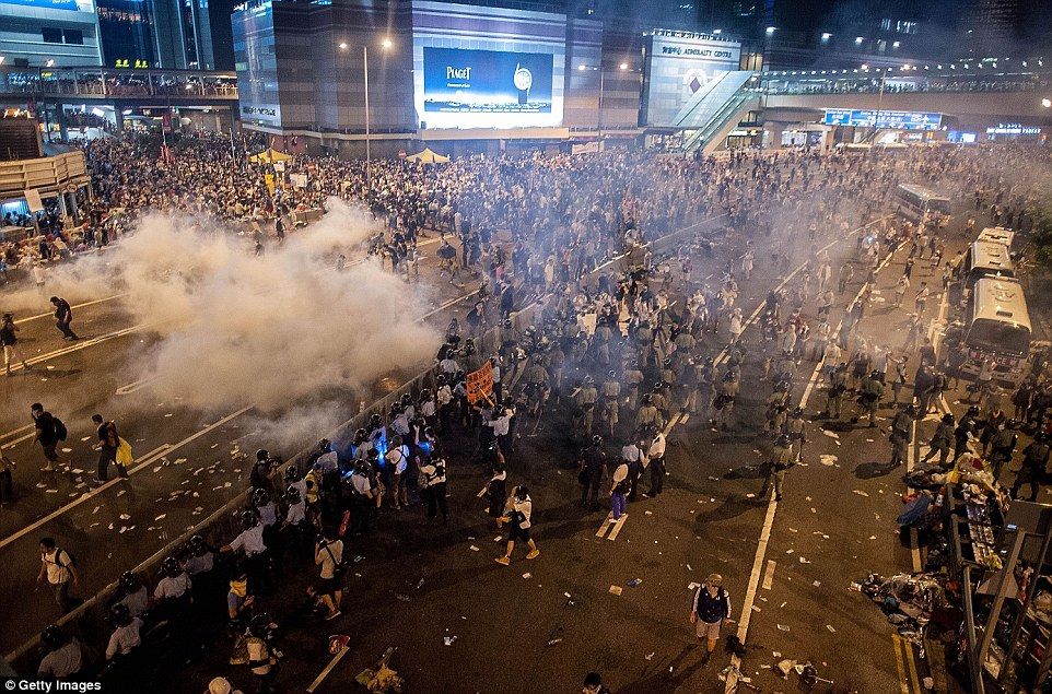 Hong Kong police rained tear gas on thousands of pro-democracy protesters in the city's financial district today as tensions over the island's democratic rights grow   Read more: http://www.dailymail.co.uk/news/article-2772604/Hong-Kong-police-use-tear-gas-clear-thousands-Occupy-Central-pro-democracy-demonstrators-warn-measures-return.html#ixzz3EzDVhssi  Follow us: @MailOnline on Twitter | DailyMail on Facebook