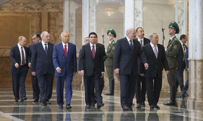 (L-R) Russia's President Vladimir Putin, Tajikistan's President Emomali Rahmon, Moldova's President Nicolae Timofti, Uzbekistan's President Islam Karimov, Armenia's President Serzh Sargsyan, Turkmenistan's President Gurbanguly Berdimuhamedov, Belarus' President Alexander Lukashenko, Azerbaijan's President Ilham Aliyev and Kazakhstan's President Nursultan Nazarbayev walk before posing for a family photo during a summit of the Commonwealth of Independent States (CIS) in Minsk, Belarus.