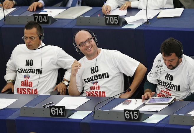 Italian Members of the European Parliament Gianluca Buonanno (L), Lorenzo Fontana (C) and Matteo Salvini attend a voting session on the EU-Ukraine Association agreement at the European Parliament in Strasbourg, September 16, 2014. The slogan on the shirts reads, 