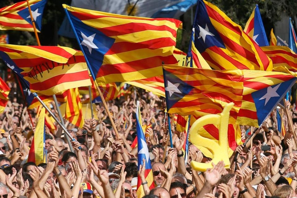 At a pro-independence celebration in Barcelona, Spain, the crowd waves the Catalonian separatist flag, Oct. 19, 2014. On Nov. 9, 2014, Catalonians will vote in a nonbinding poll on the region’s independence from Spain. Albert Gea / Reuters